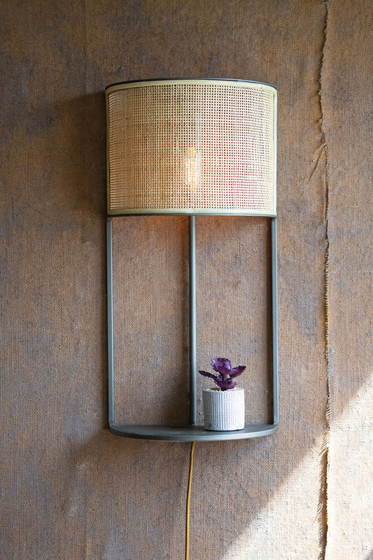 Wall sconce light with rattan shade and metal shelf